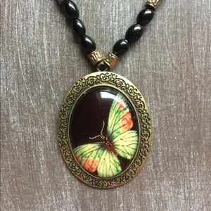 Black Beaded Necklace with Brass Butterfly Pendant